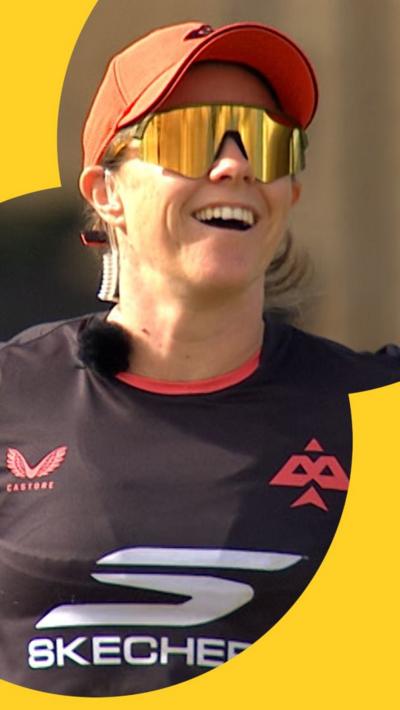 Tammy Beaumont laughs while talking into her microphone