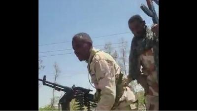 Soldiers raising guns to celebrate