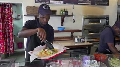 Man serving food in restuarant