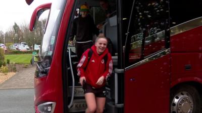 Wales players arrive home