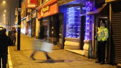 Police officer outside Birmingham property