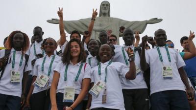 Members of the Refugee Olympic Team pose for a photo in front of the Christ the Redeemer statue on July 30, 2016 in Rio de Janeiro, Brazil.