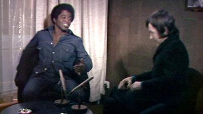 James brown sits opposite his interviewer