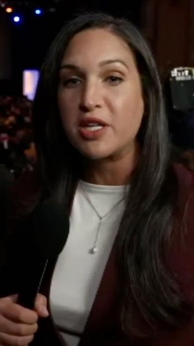 Nada Tawfik holding mic