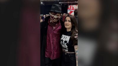 Mel Ramsay with a man dressed up as a zombie with a cowboy hat