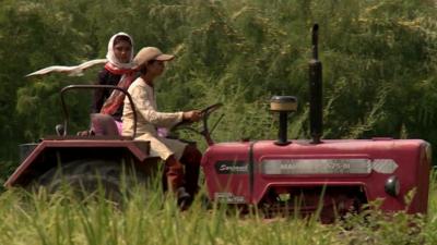 Rimppi and her sister Karamjit driving their tractor