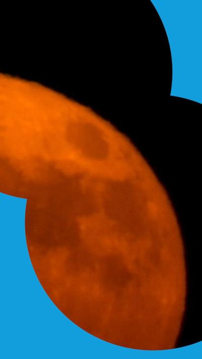 A partial view of the Moon looking red