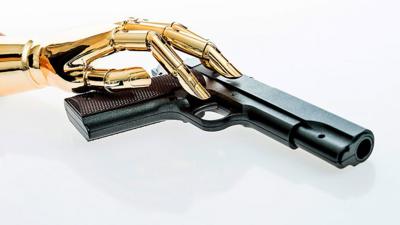 A robotic hand on a gun