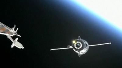 Cargo spacecraft with Earth in the background