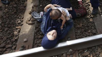 Woman and baby lying on tracks at Hungarian town of Bicske