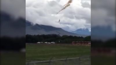 A pilot ejects from the aircraft