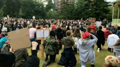 Protestors take a knee in demonstration