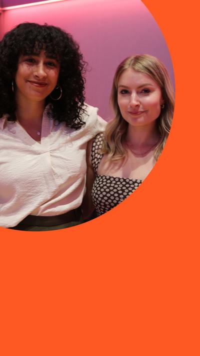 Stylist journalist Shahed Ezaydi and author Emma Lucy stand in a room with their arms around each other