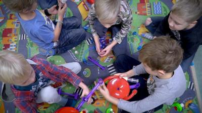 Estonian children play at kindergarten.