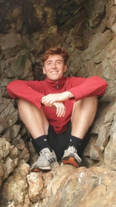 A man with red hair and a red top