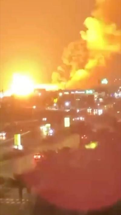 Iranian city street lit up by explosion