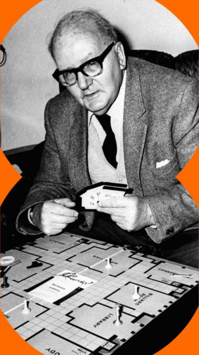 A black and white photo of an old man wearing glasses and a suit, playing Cluedo