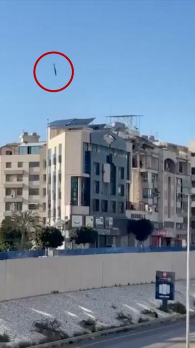 A missile circled in red above a building in Beirut