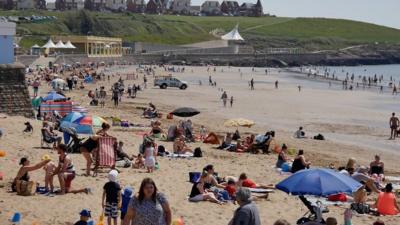 Barry Island beach with crowds on 24 June, 2020