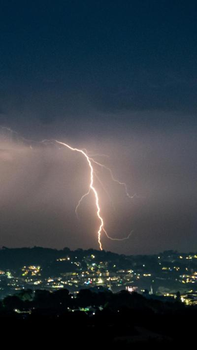 A lightning strike in Torquay. It is cloudy and grey.