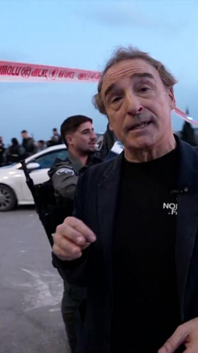 BBC Middle East analyst Sebastian Usher standing in front of police cordon