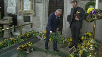 Prince Charles lays a wreath