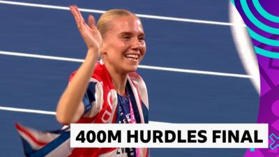 Emily Newnham beams while celebrating silver in the 400m hurdles final