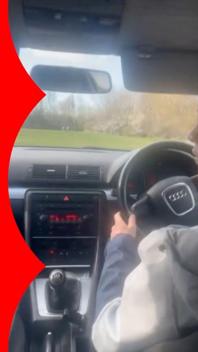 View from back seat of person driving a car