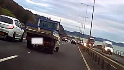 Truck veers into wrong lane