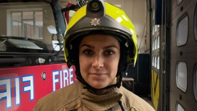 Chloé Cassar in firefighters uniform