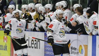 Belfast Giants bench celebrate a goal against Dundee Stars