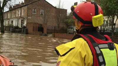 Boat journey down flooded street