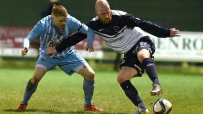 Action from Warrenpoint Town against Ballinamallard United