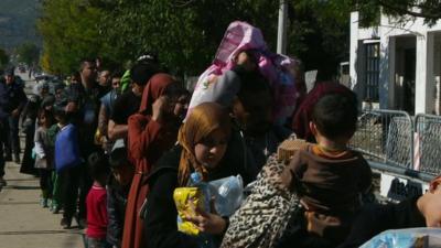 Migrants queue in Serbia