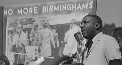 Activist protesting against the violence in Birmingham