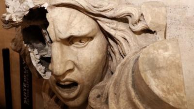 A vandalised statue of Marianne, a symbol in France, seen inside the Arc de Triomphe after Paris riots