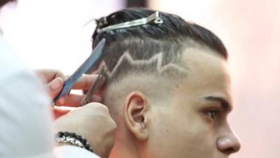 Egyptian getting hair cut in trendy style