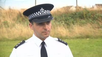 The arrest of a Royal Marine in Somerset over Northern Ireland-related terrorism is followed by police searches in Larne, County Antrim and Exminster, Devon.