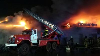 Firefighters tackle flames at the nightclub in Russia