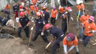 Rescue workers at Guatemala mud slide