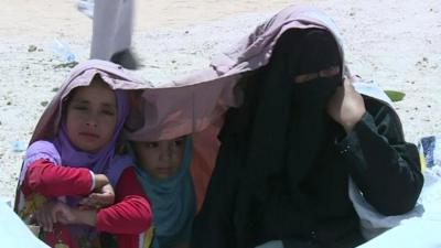 Woman and children in camp