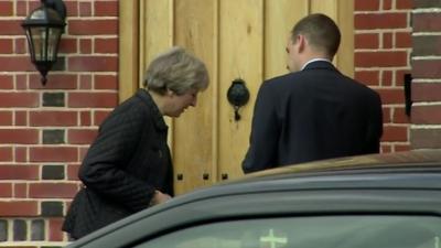 Theresa May knocks on door