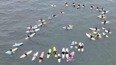 Surfers in a circle in the water