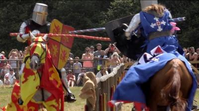 Tom getting medieval on another knight