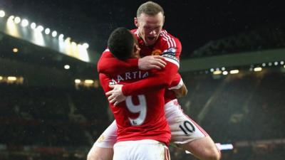 Manchester United forward Wayne Rooney celebrates scoring against Swansea City with Anthony Martial