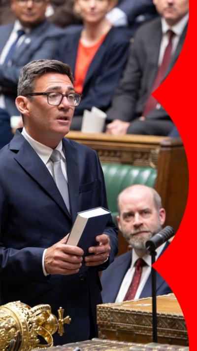 Andy Burnham is holding a book in the House of Commons