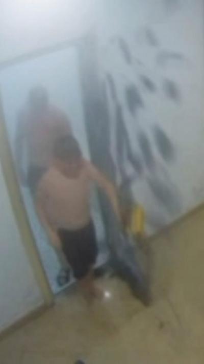 CCTV of two boys leaving a steam room