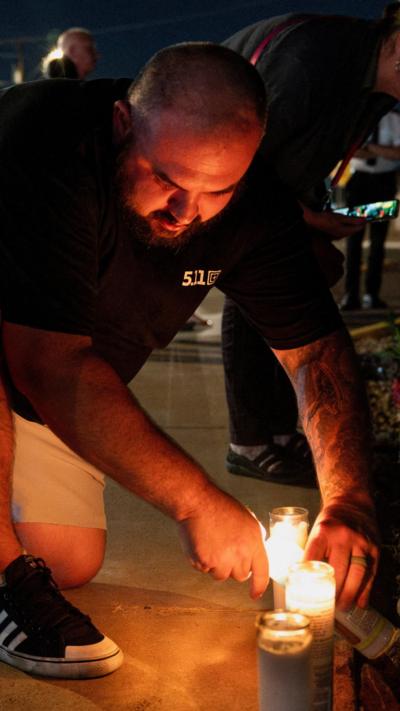 A man lights a candle in Phoenix