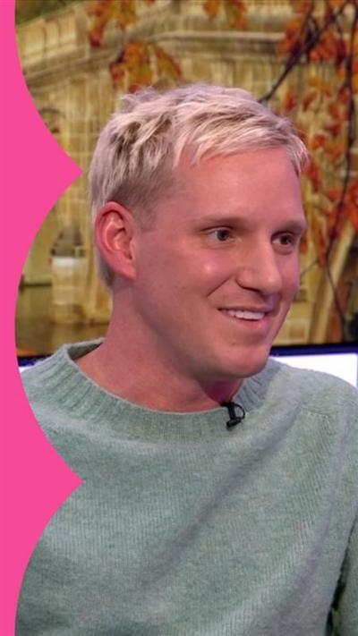 TV personality Jamie Laing sat on the One Show sofa wearing a light green jumper and smiling