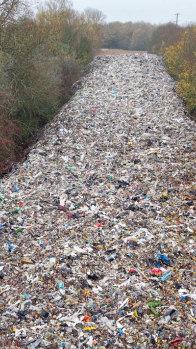 A field full of illegally dumped waste.